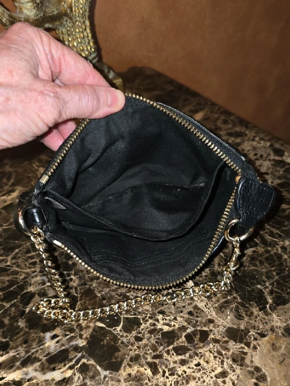Coach Black Leather Mini Wristlet with Gold Chain 8' L x 5' H.